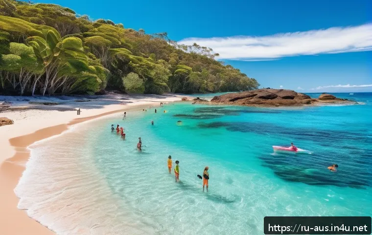 호주 바다에서 상어주의 지역 - A serene Australian beach scene at midday along Queensland’s coast near the Great Barrier Reef, show...